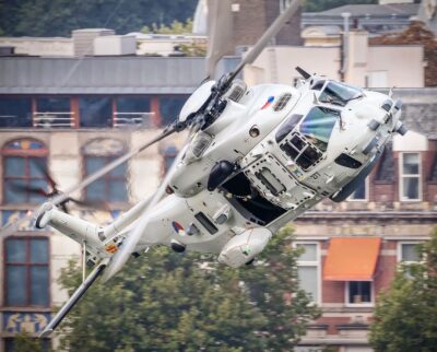 A Royal Netherlands Navy NH-90 banks steeply over Rotterdam. From Instagram user arrecoos_nh90_pictures